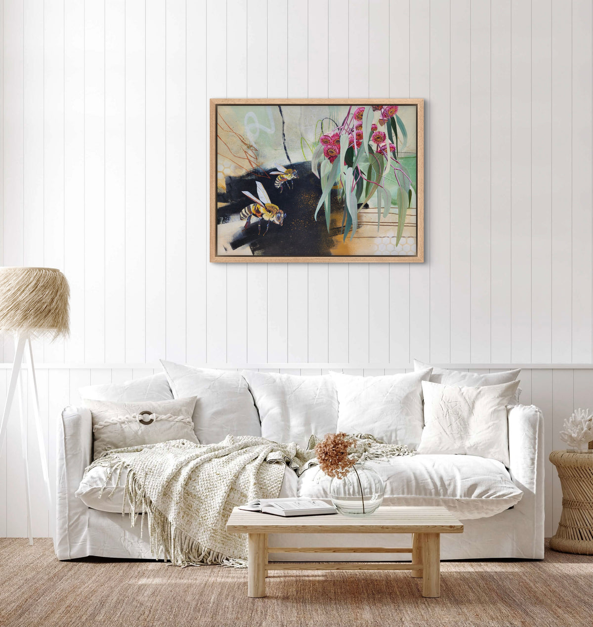 Beauty in the small things is a bee and gum leaf painting by Australian artist Hanna Edwards on display in modern interior