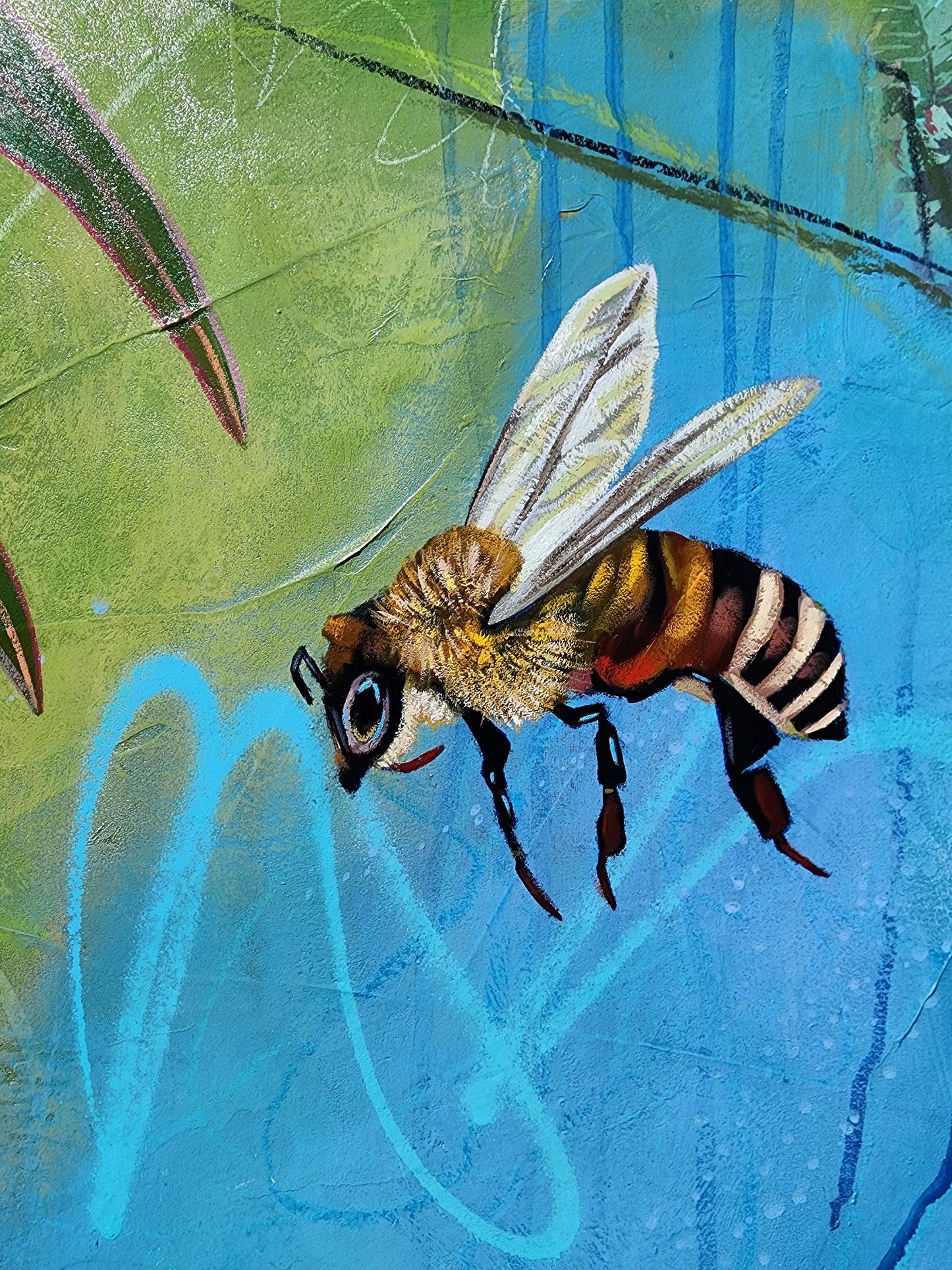 Colorful bee on a textured blue and green background