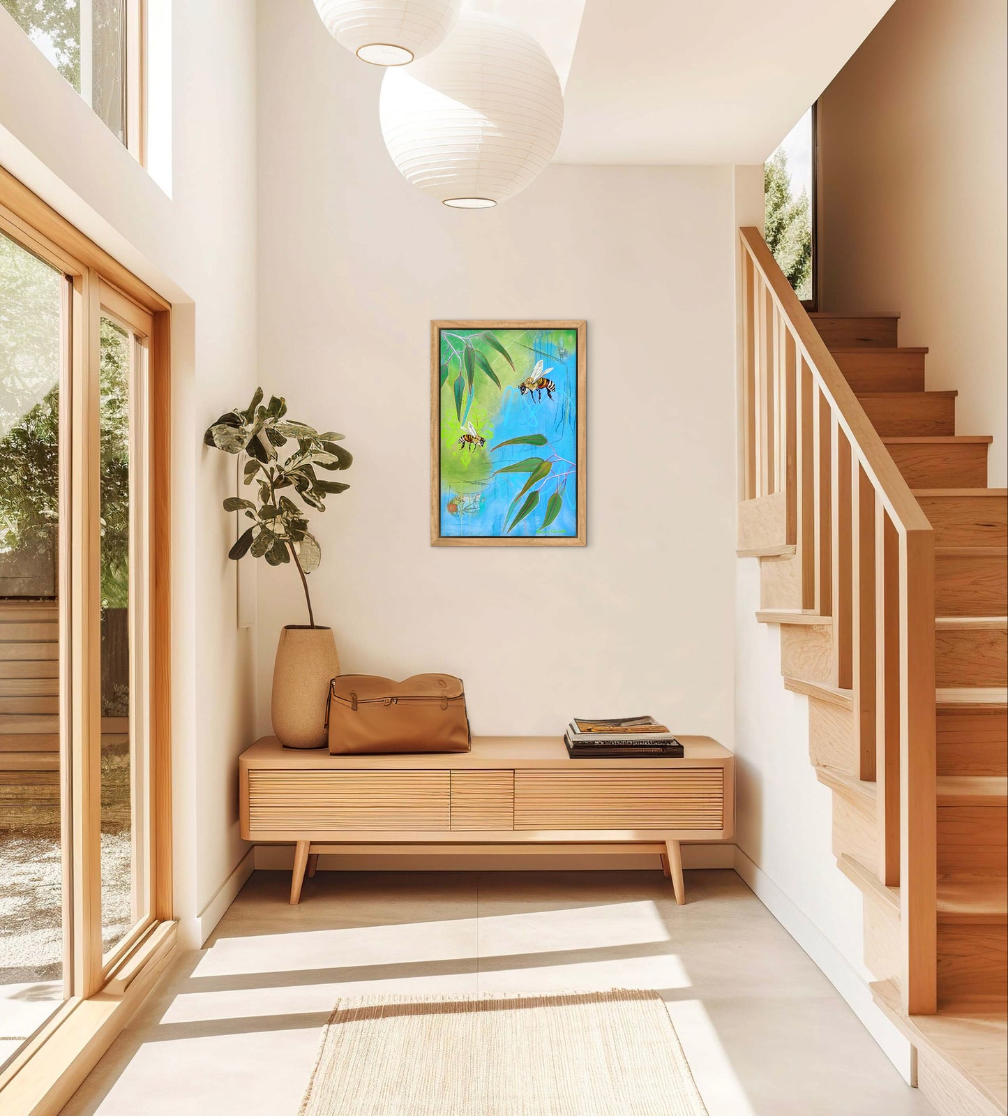 Modern interior with a wooden bench, plant, and artwork on the wall.
