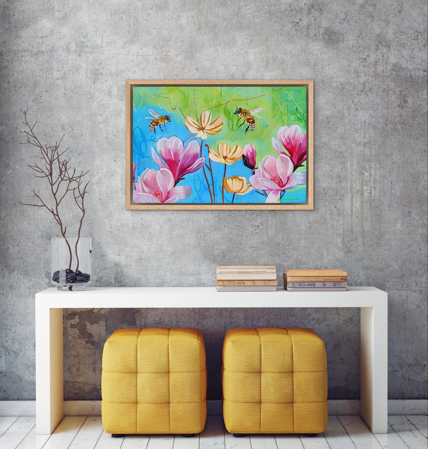 Colorful floral painting above a white console table with yellow stools against a gray wall.