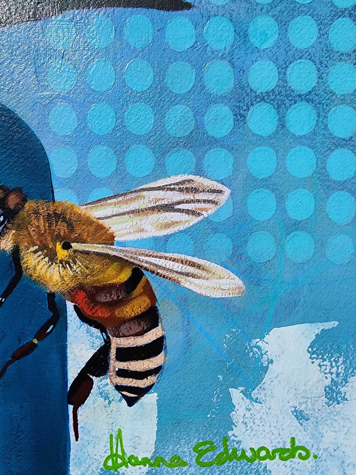 Painting of a bee on a blue textured background with artist Hanna Edwards signature in green.