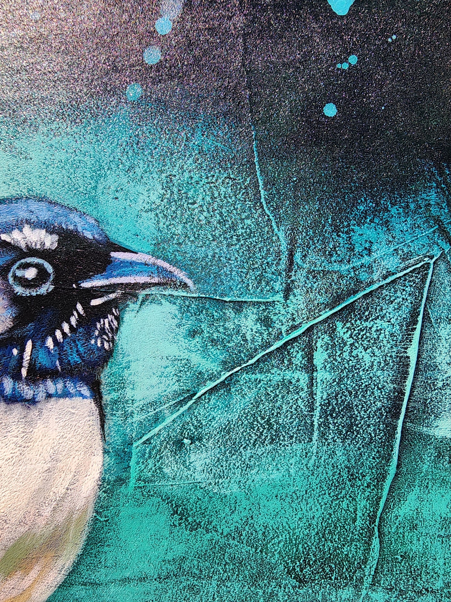Close-up of a blue and white bird illustration on a textured teal background