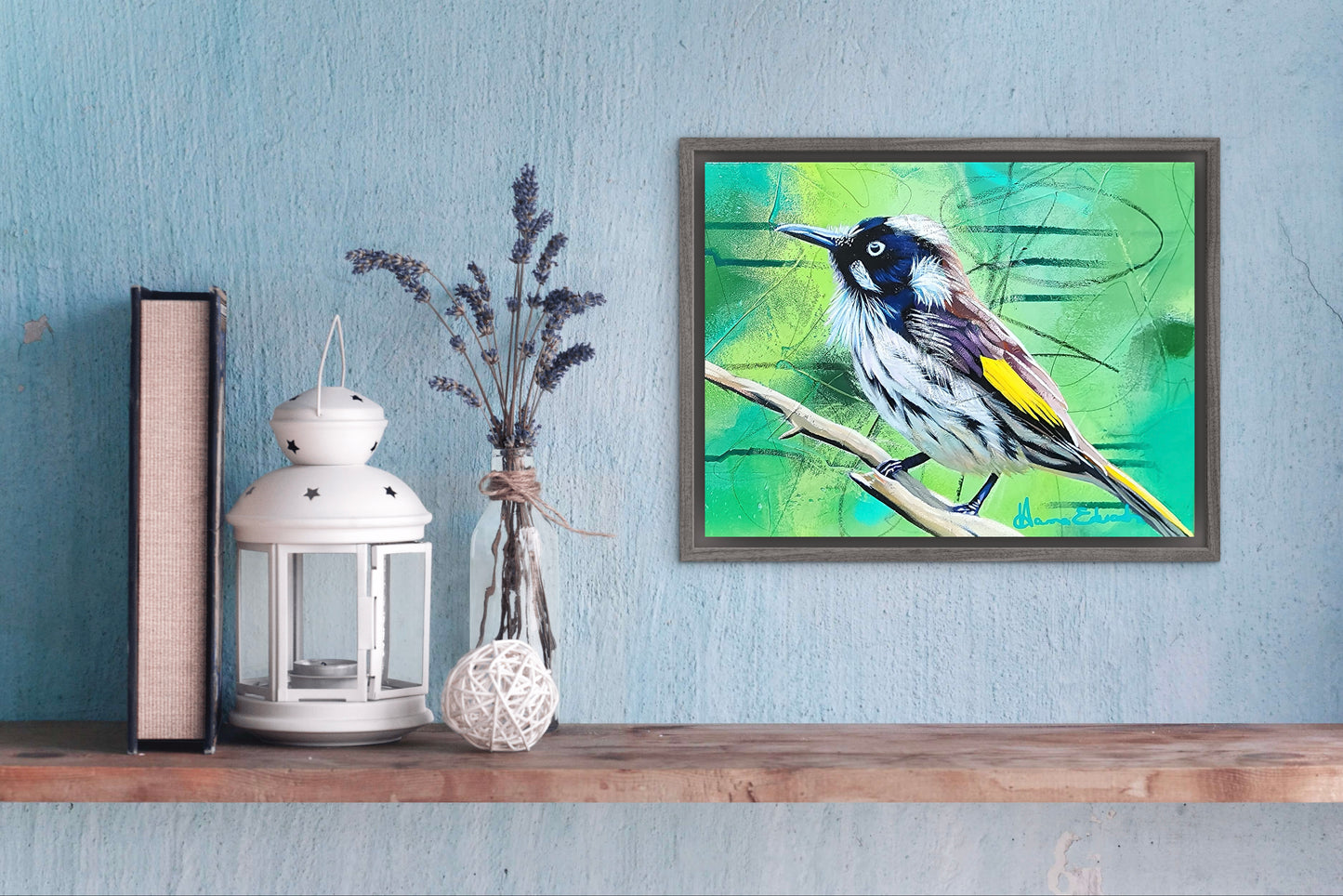 Framed artwork of a bird on a shelf with decorative items against a blue wall.