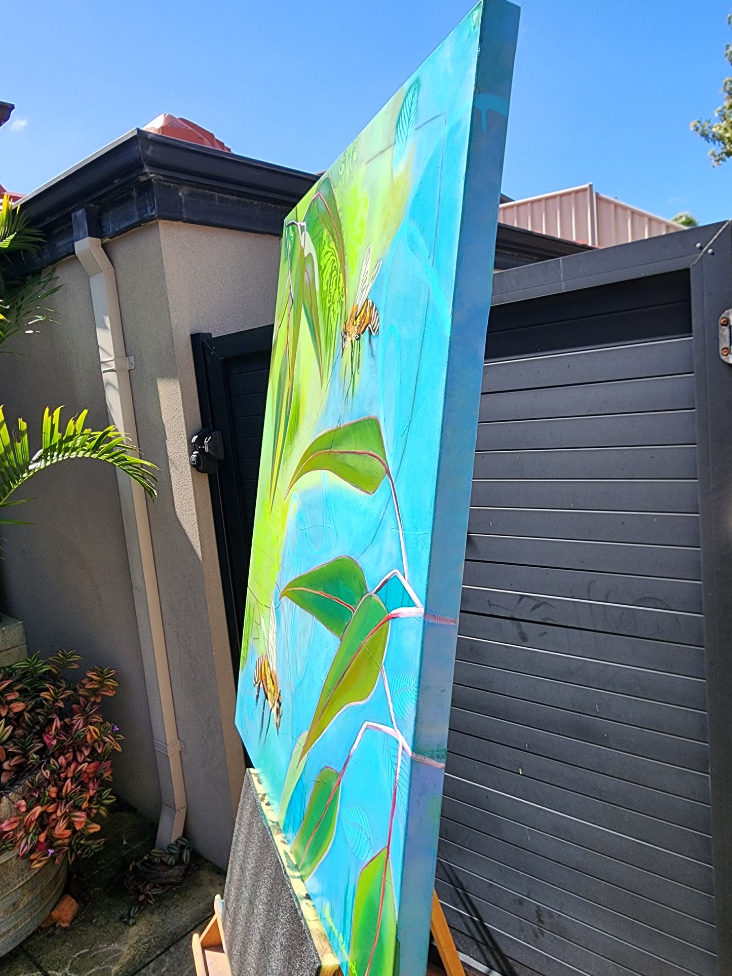 Side view of painting sitting on timber easle
