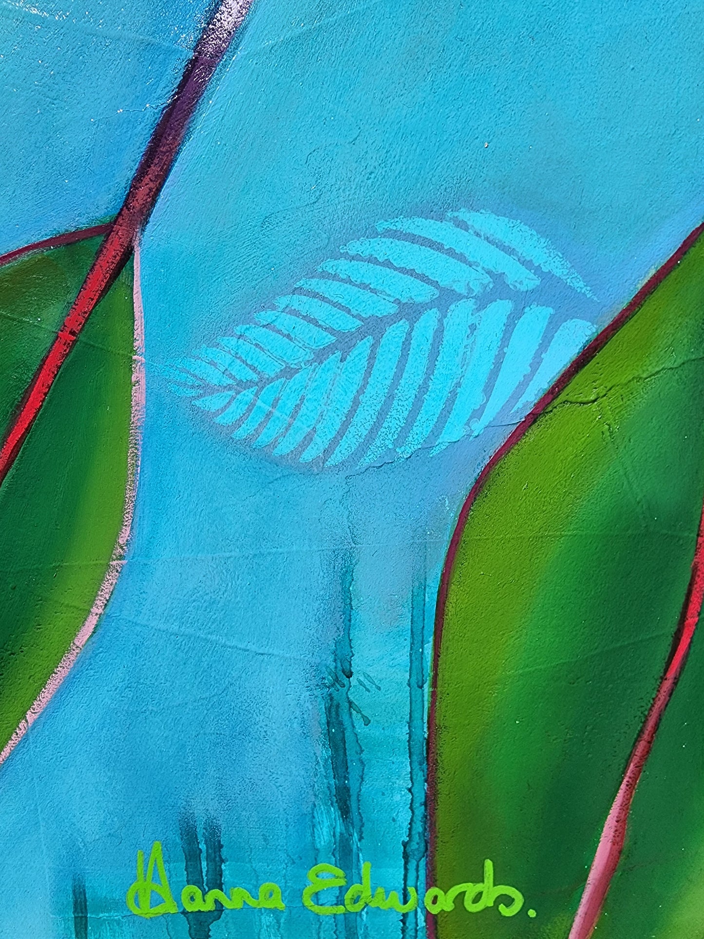 Close-up of a leaf with turquoise and green colors, featuring Hanna Edwards signature