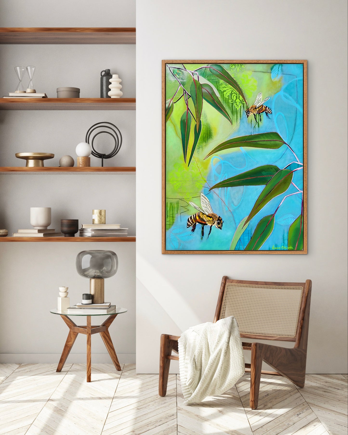 Living room with a colorful abstract painting of bees and leaves on a wall.