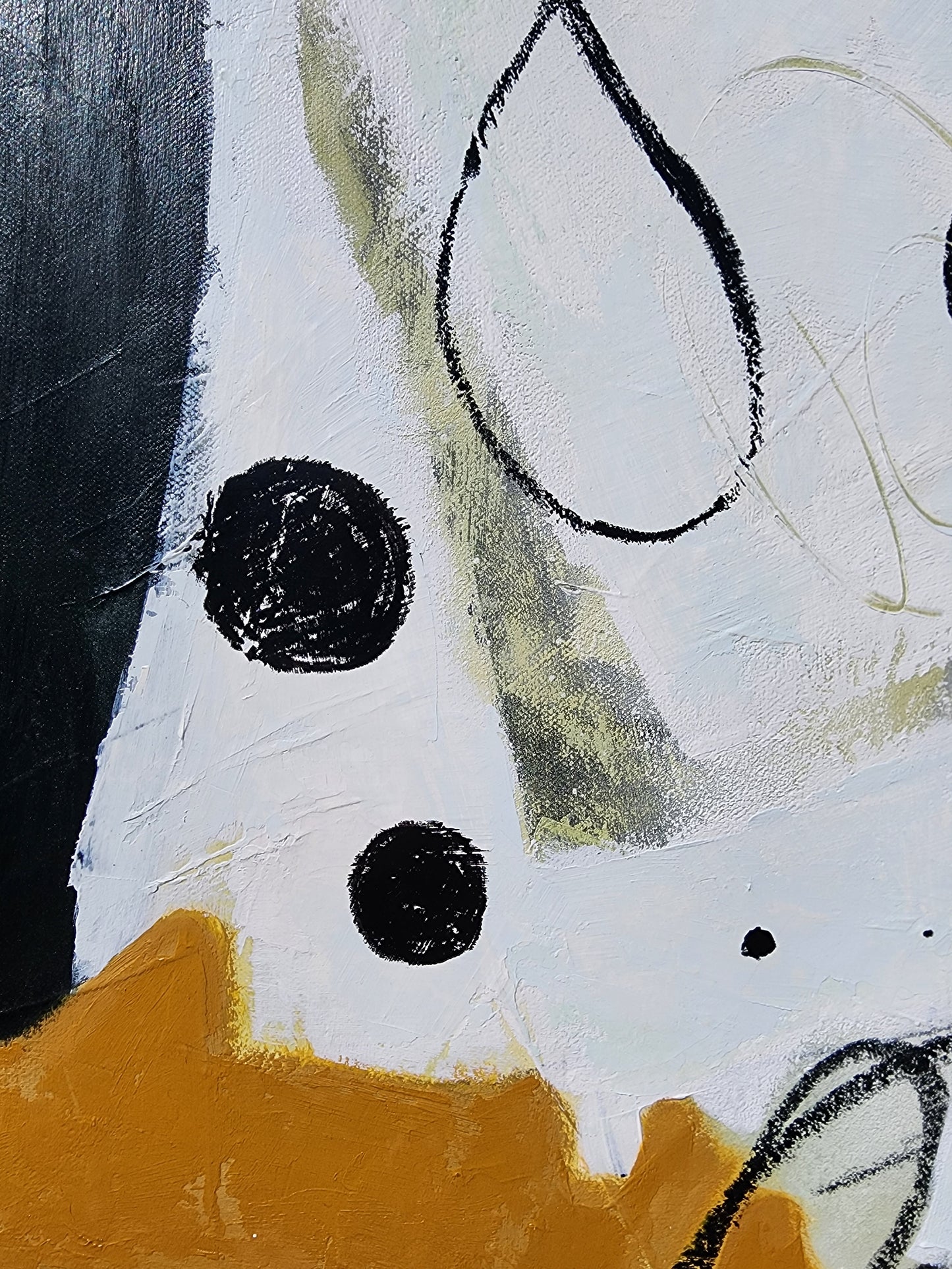 Abstract art with black, white, and orange elements on a textured surface