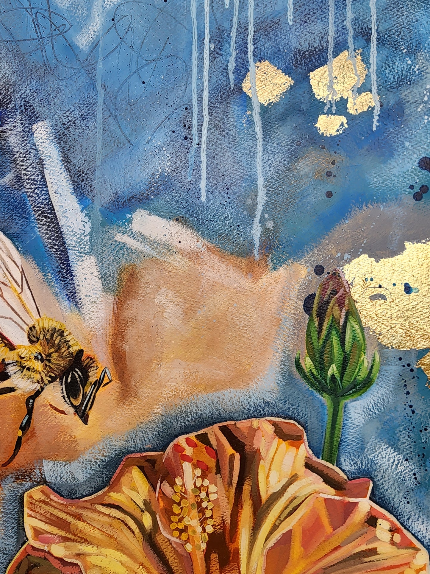 Close-up of orange hibiscus bee and blue and orange background with gold elements