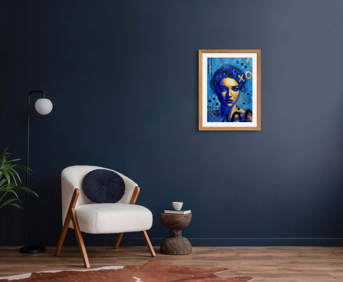 Colourful female portrait with bold blue and yellow tones and expressive texture, artwork by Australian artist Hanna Edwards on display in modern interior