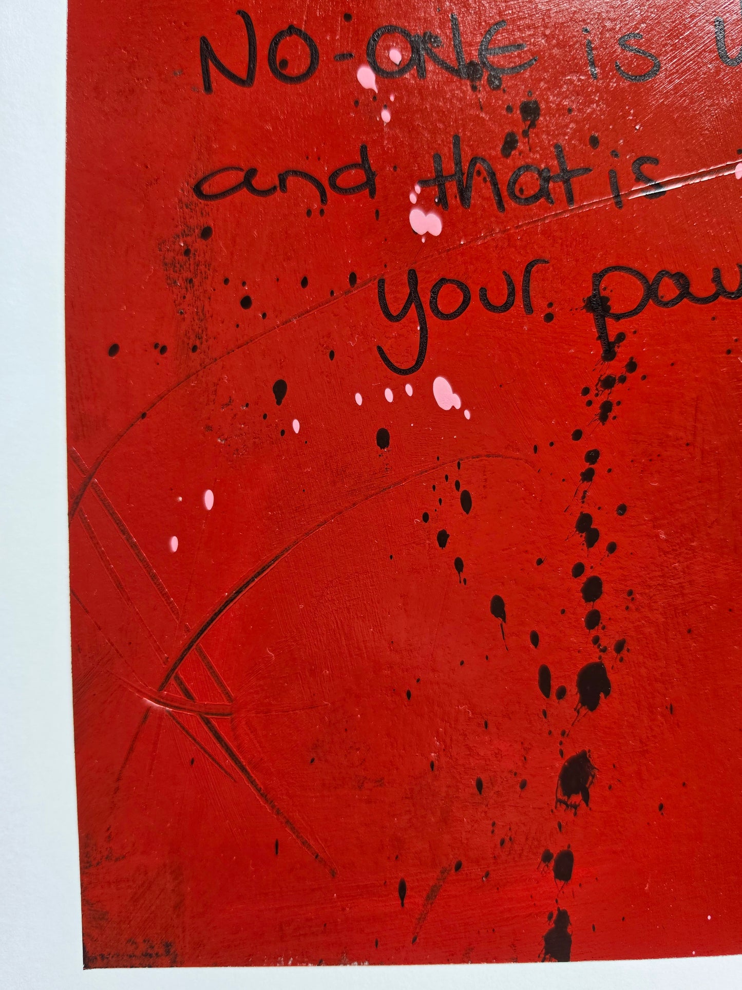 Red painted background with black text and texture with a white boarder
