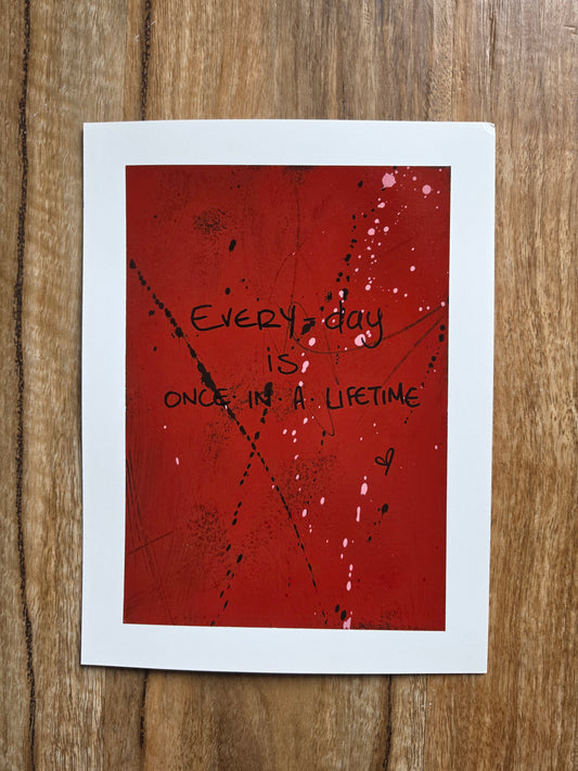 Red painting with black text Every day is  Once In A Lifetime with black spots and pink drips