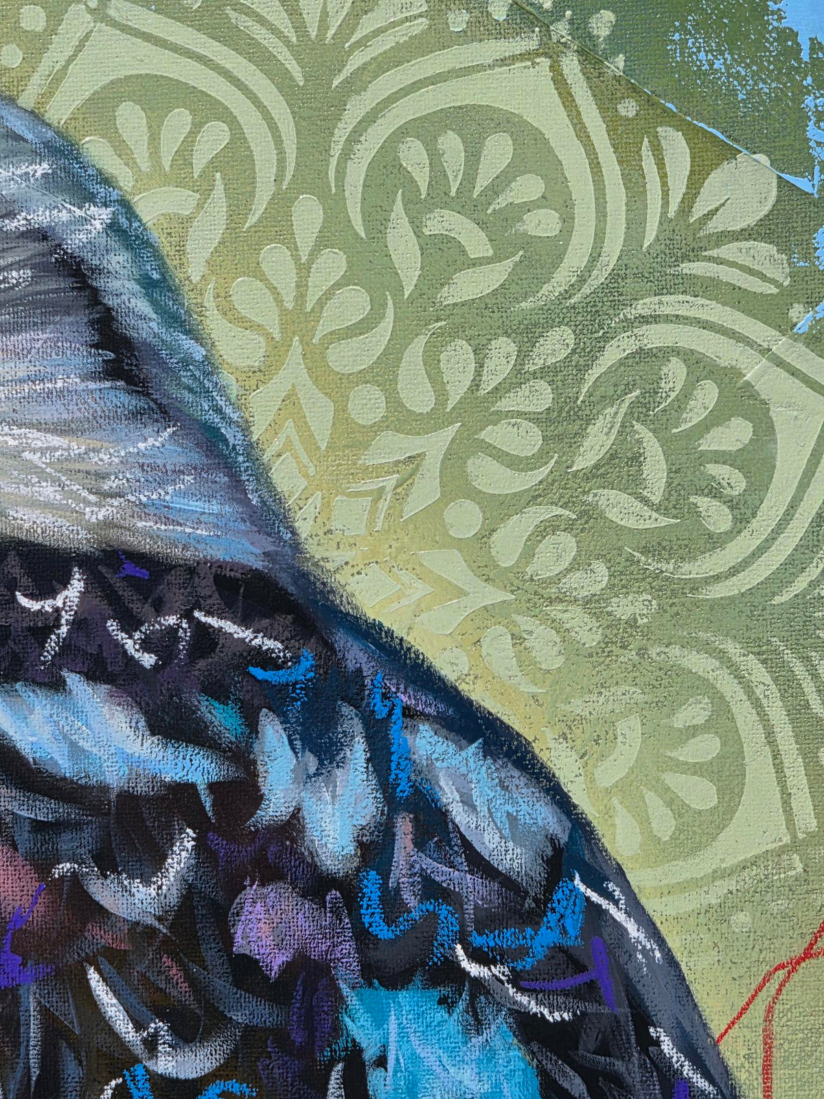 Close-up detail of “Liberation,” an original mixed media oil painting by Australian artist Hanna Edwards, showing the kookaburra’s textured blue, black and purple feathers against a layered green background with decorative patterns and expressive marks.