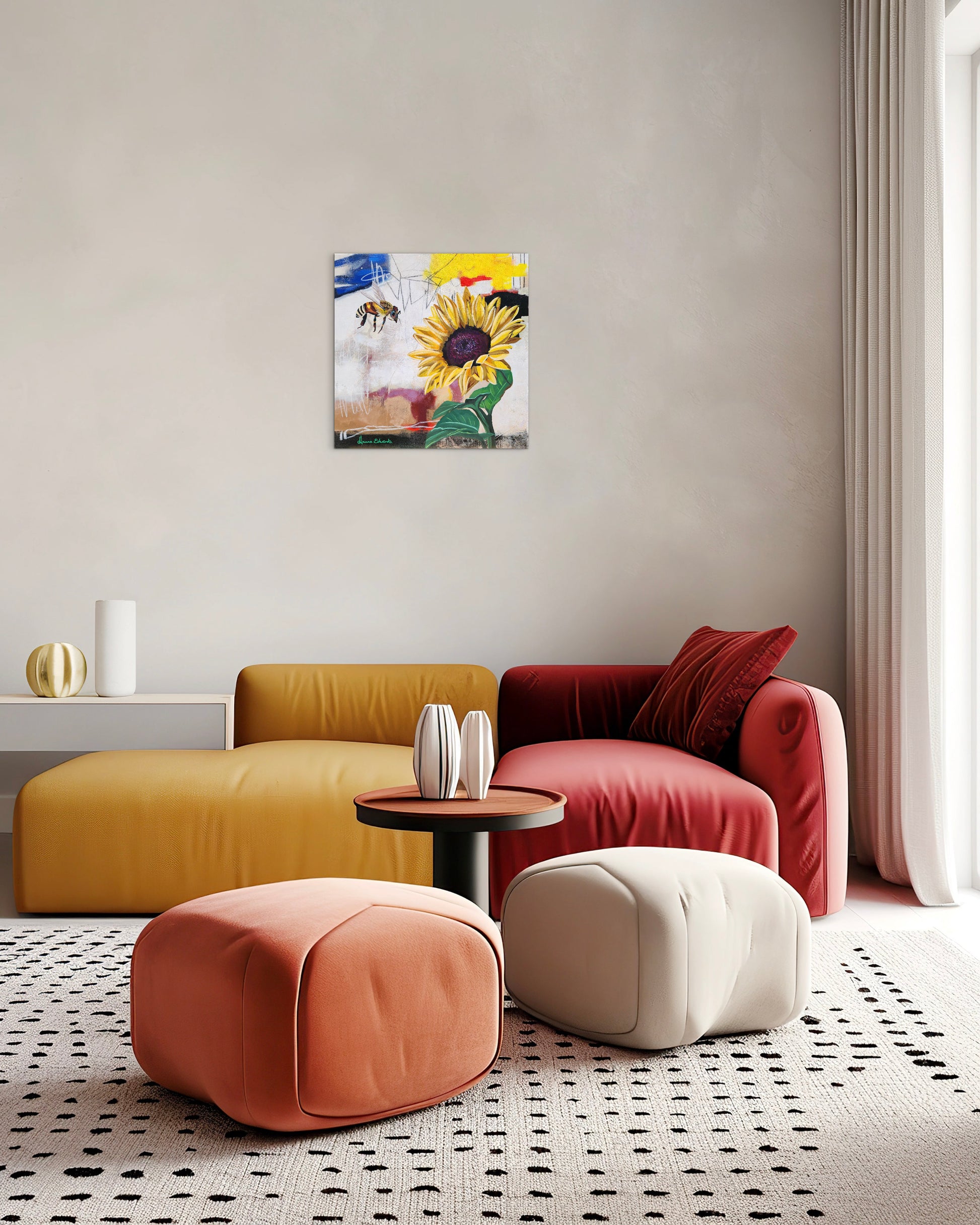 Modern living room with colorful furniture and a sunflower painting on the wall.