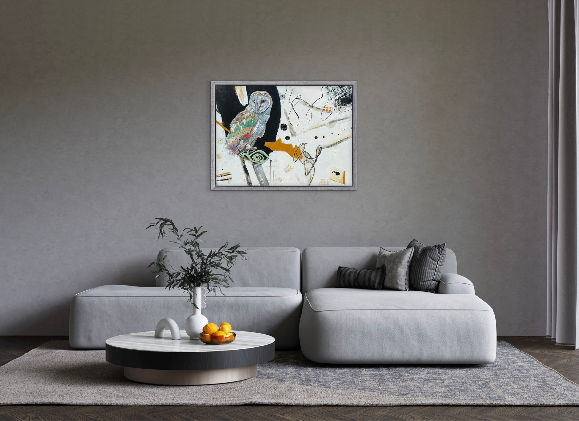 Modern living room with a gray sofa, coffee table, and abstract painting on the wall.
