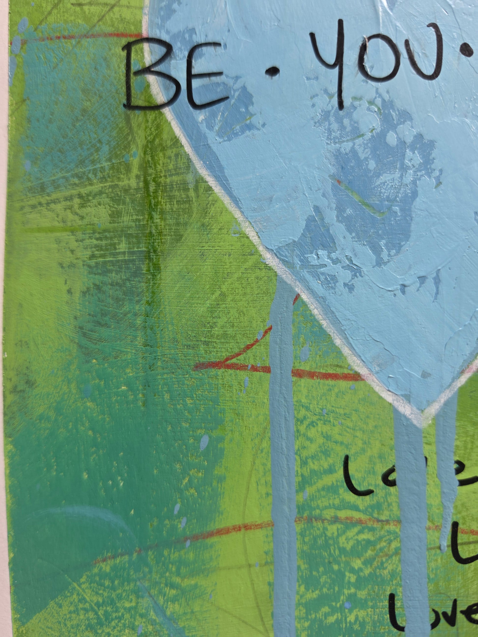 Abstract art piece with text 'BE YOU' on a textured background