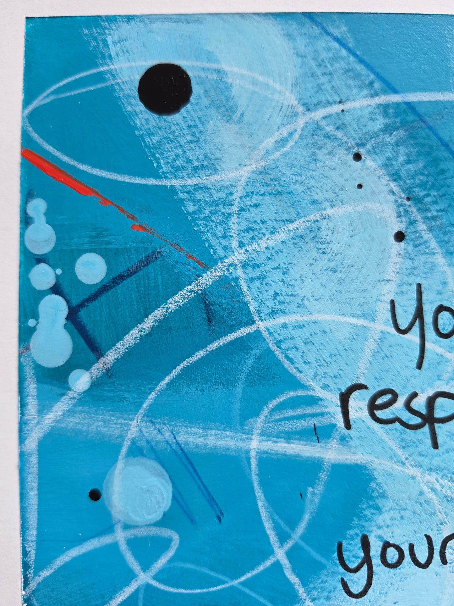 Abstract painting in blue with scribble marks, black drips and pops of bright red close up