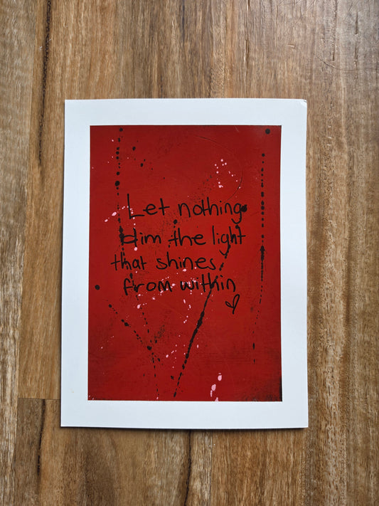 Red painting with the words let nothing dim the light that shines from within in black text on a wooden surface