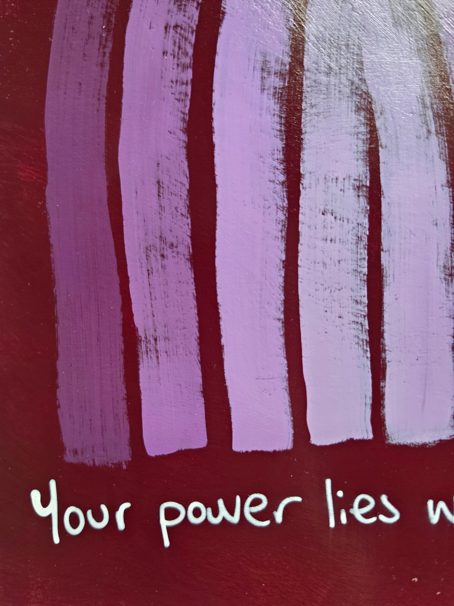 close up of painting or purple/red  background with words from quote Your power 