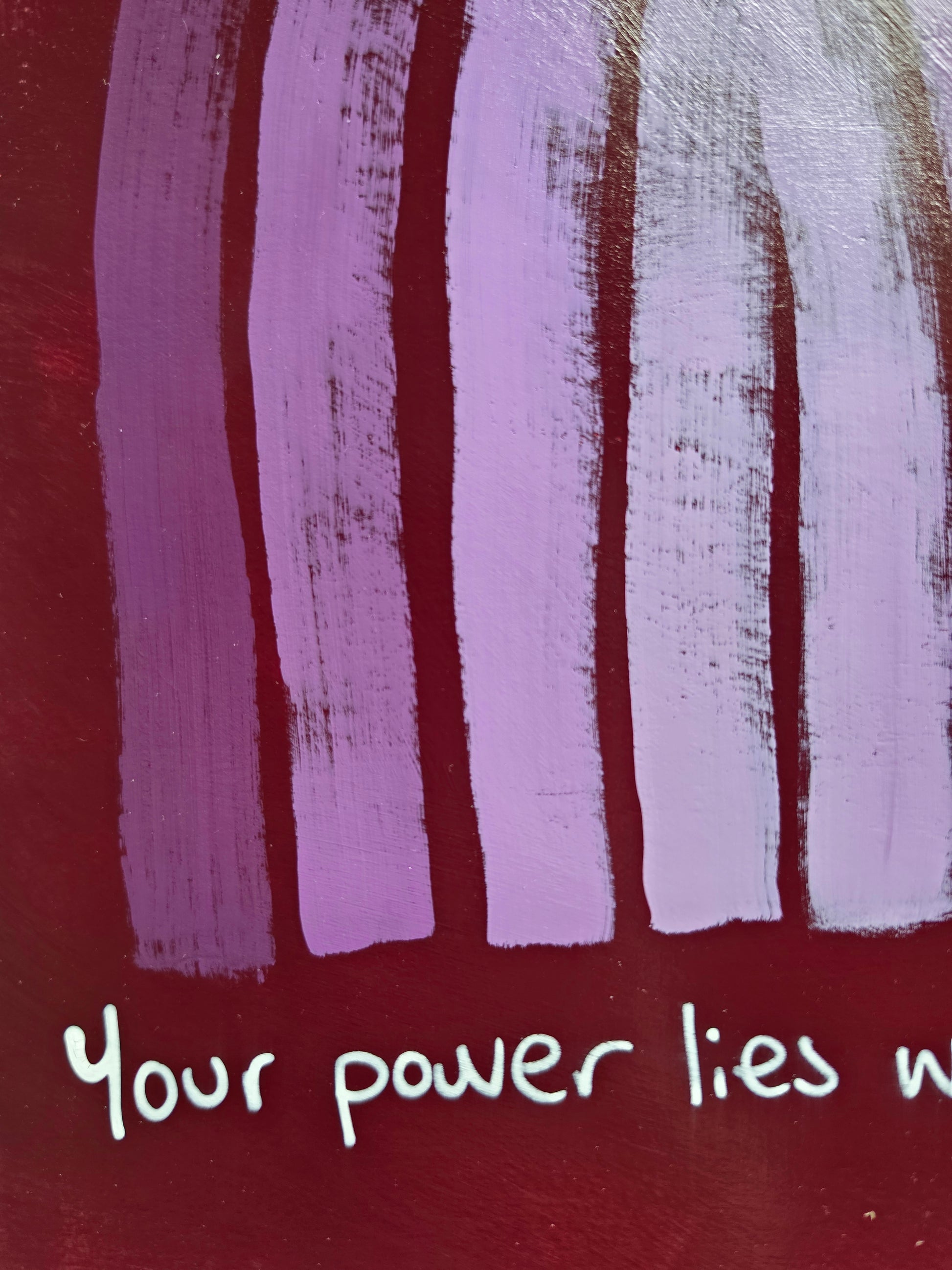 close up of painting or purple/red  background with words from quote Your power 