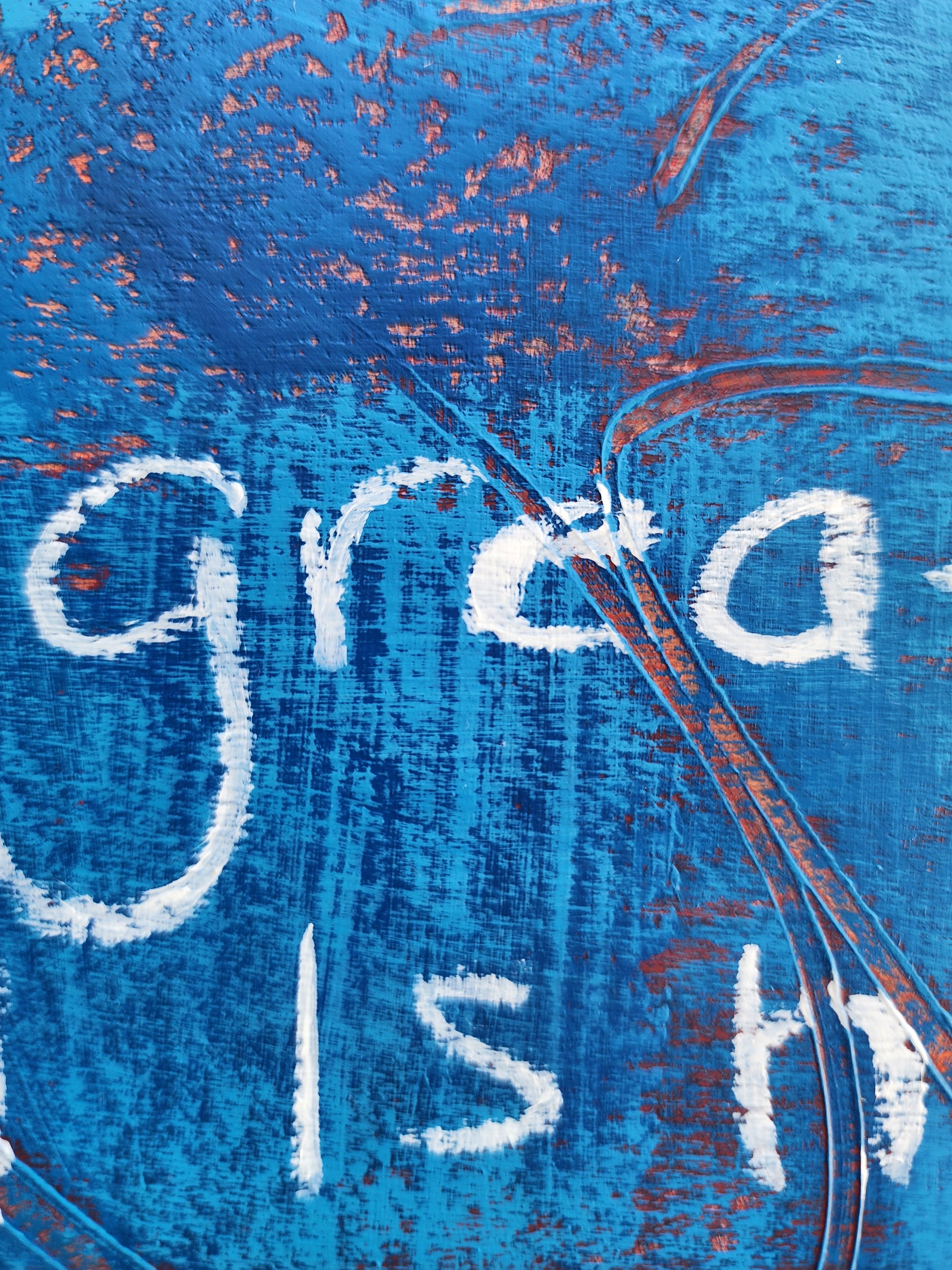 Close up of painting on a textured blue background