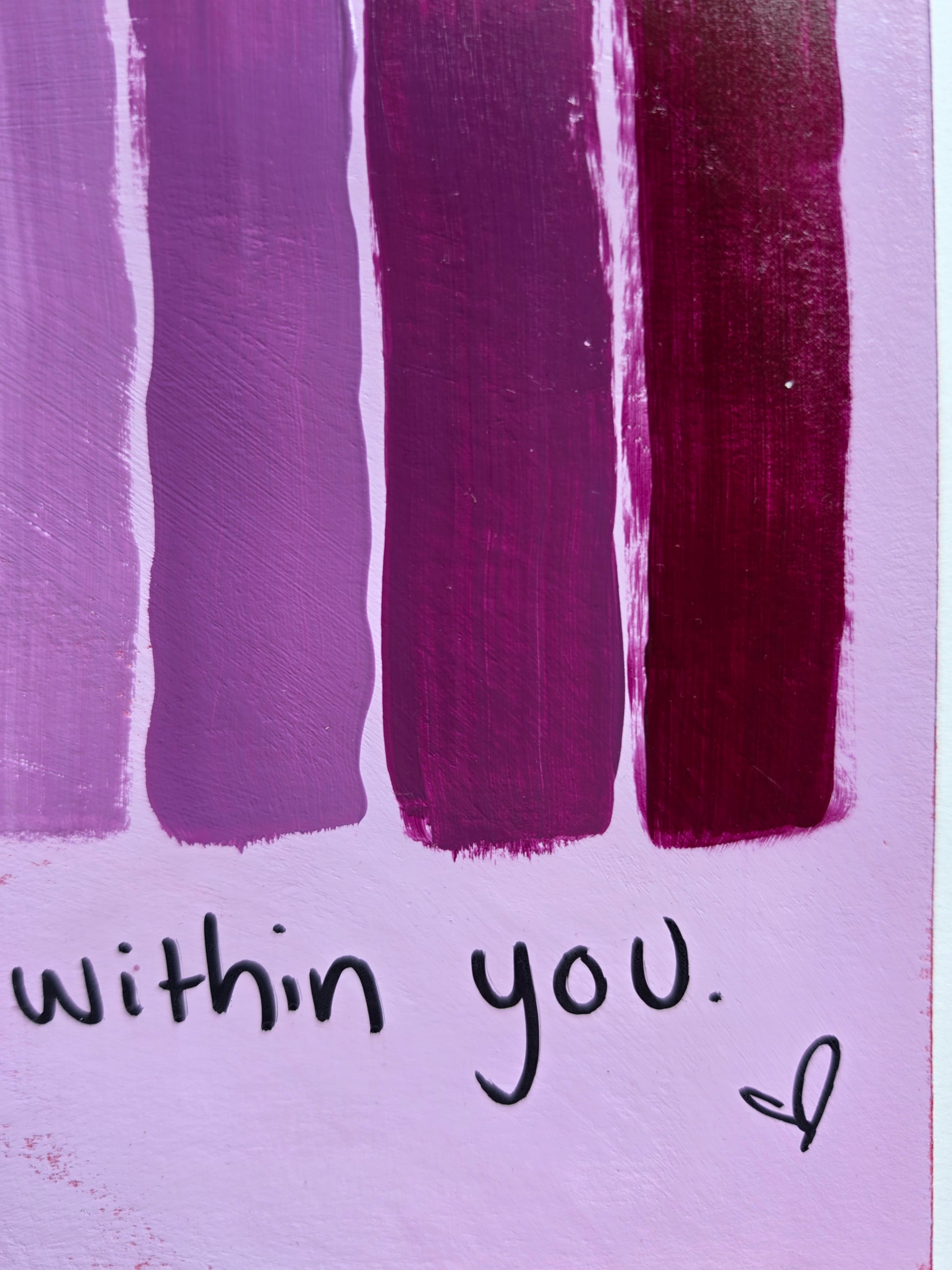 close up of purple and pink vertical stripes with the text 'within you.' on a light purple background.