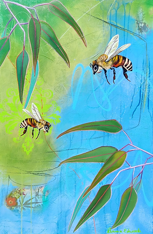 Two bees flying among green leaves and a blue abstract background