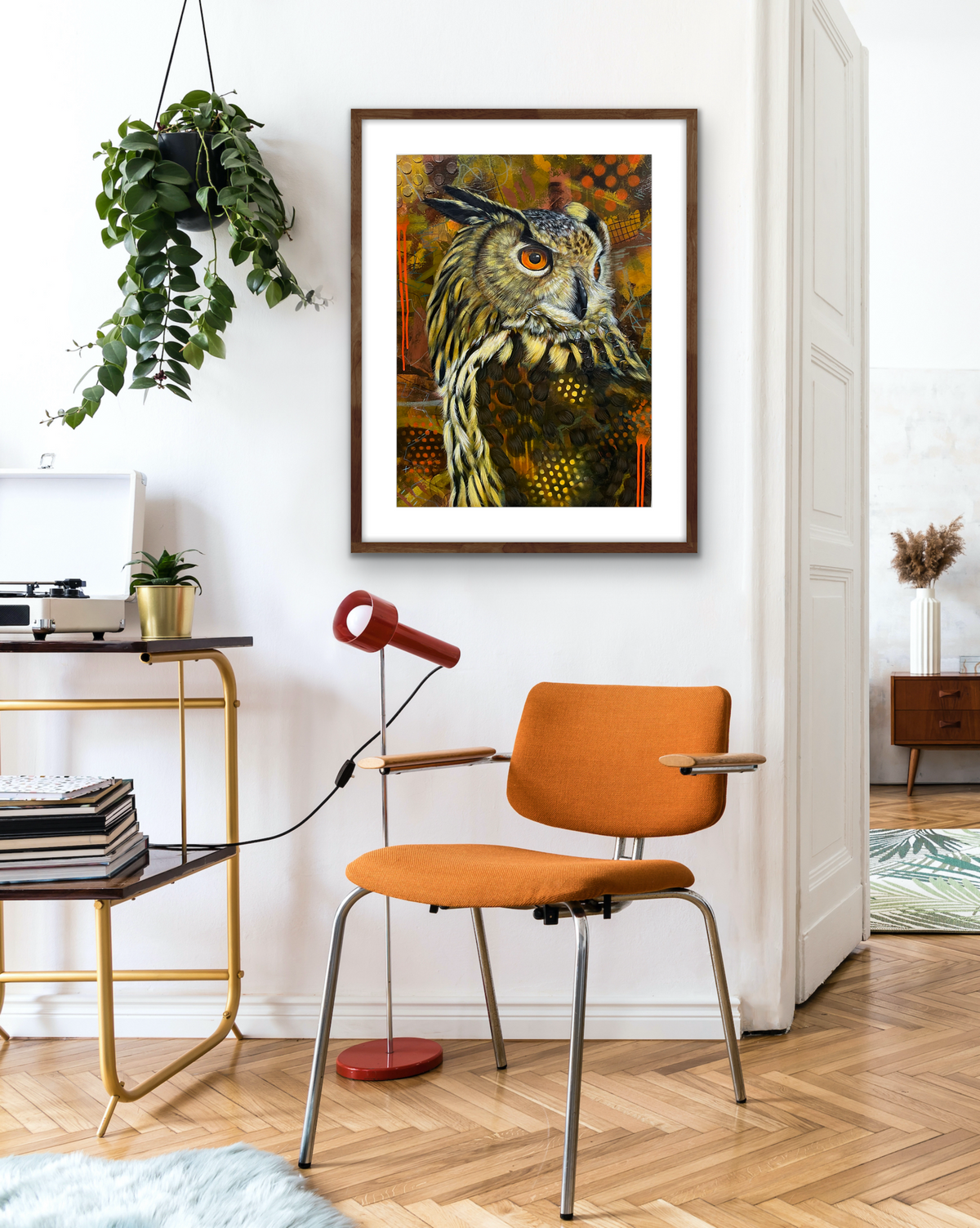 Colourful owl artwork with orange eyes and layered texture by Australian artist Hanna Edwards on display modern interior