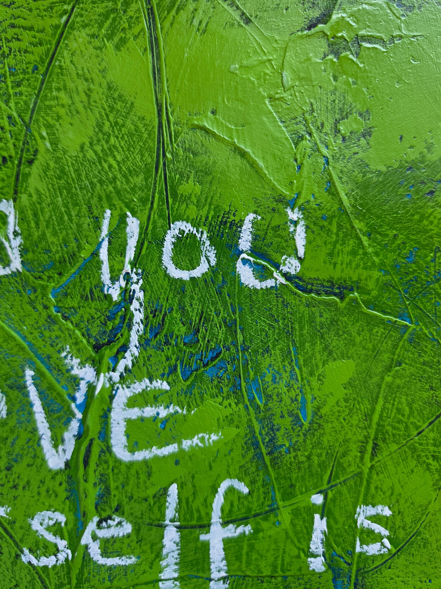 Abstract painting heavily textured in green with pops of teal and blue popping through with the words  in white handwriting close up