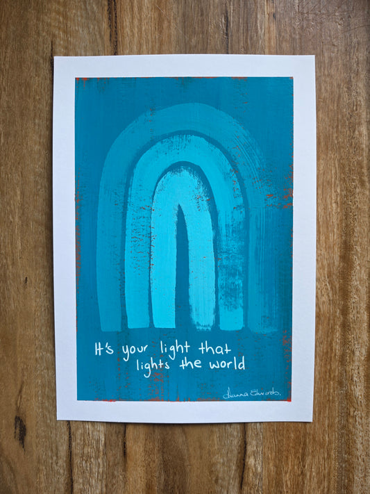 Painting with a white border a blue background with red popping through and turquoise rainbow design with the quote 'It's your light that lights the world' written by hand in white with artist Hanna Edwards signature 