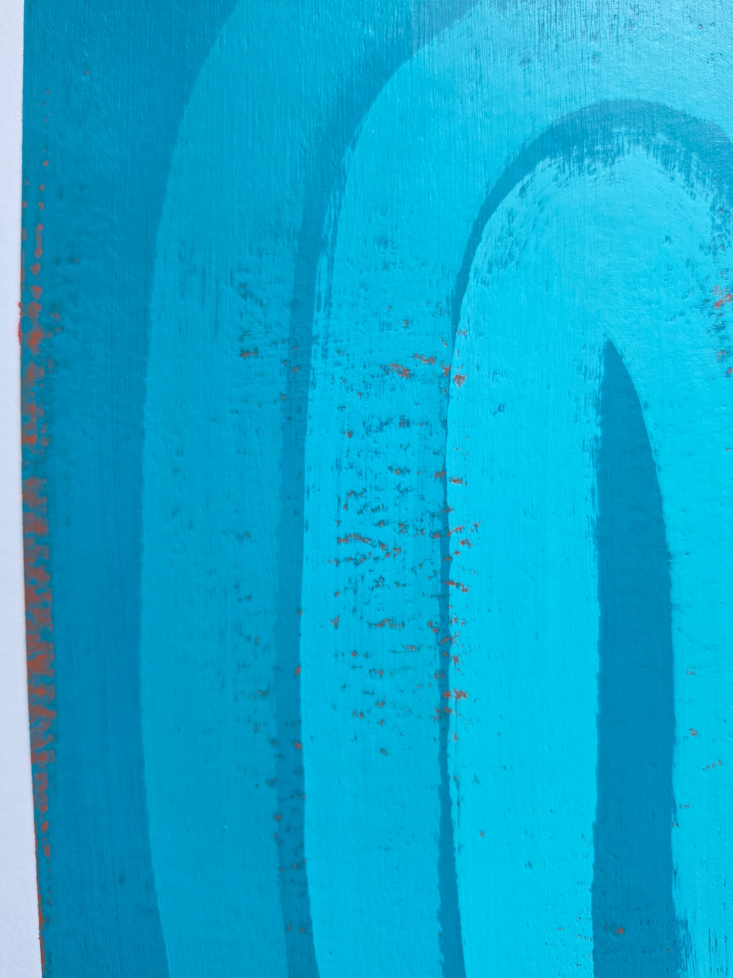  painted artwork featuring arches in turquiosee with visible distressed texture and small red speckles.