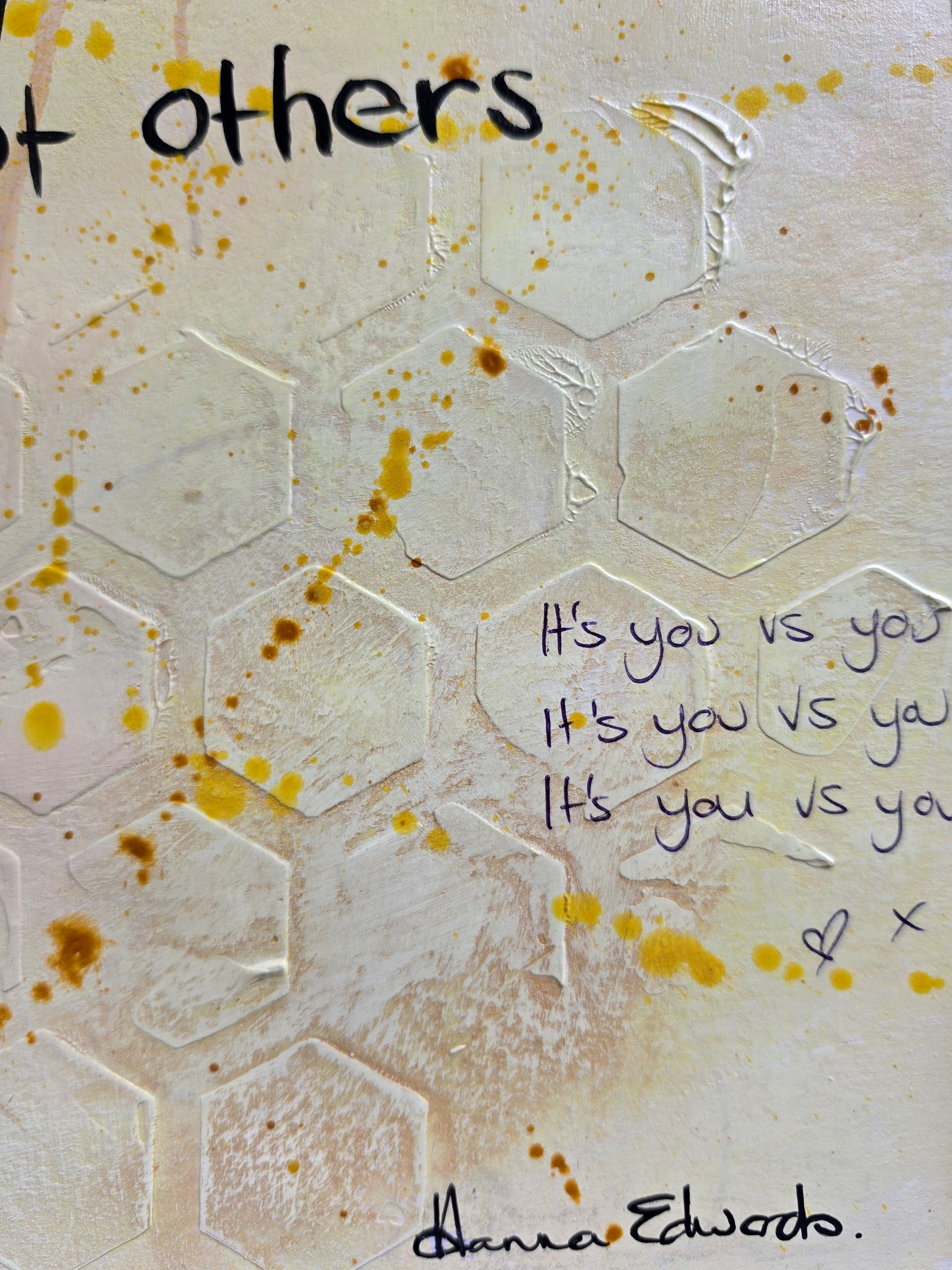 Textured  artwork close up featuring a honeycomb pattern, yellow paint splatters, and handwritten with Artist Hnna Edwards signature