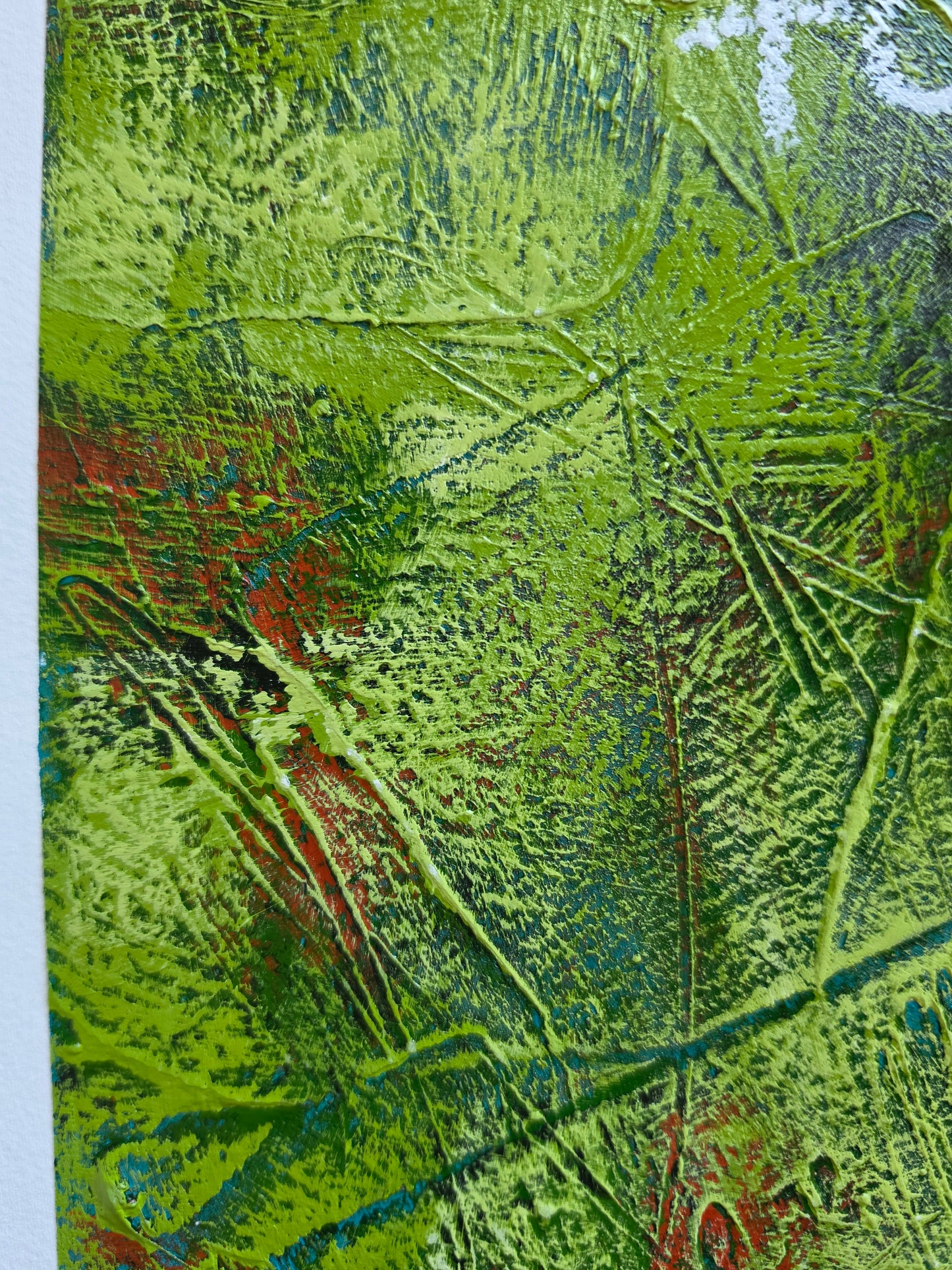 Abstract painting heavy texture in green with pops of green , teal and red close up